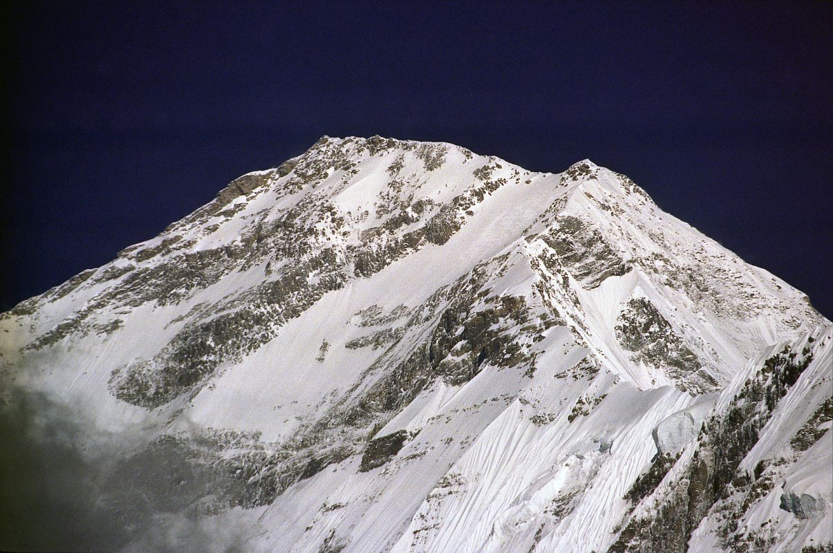 408 Dhaulagiri South Face Close Up Early Morning From Lete �What's the south face like?� inquired Ichac. ... Lachenal: �monstrous slope, several miles high, and without a break, something like the north face of the Matterhorn, which as you know isn't exactly an attractive place, only this is three times as big.� Herzog: �The best thing is just to write off the south face� (Maurice Herzog, Annapurna). Here is a close up of the Dhaulagiri South face in the early morning sun from Lete.